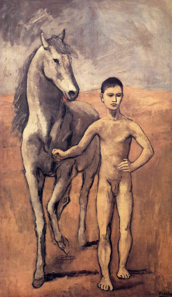 A boy leading a horse