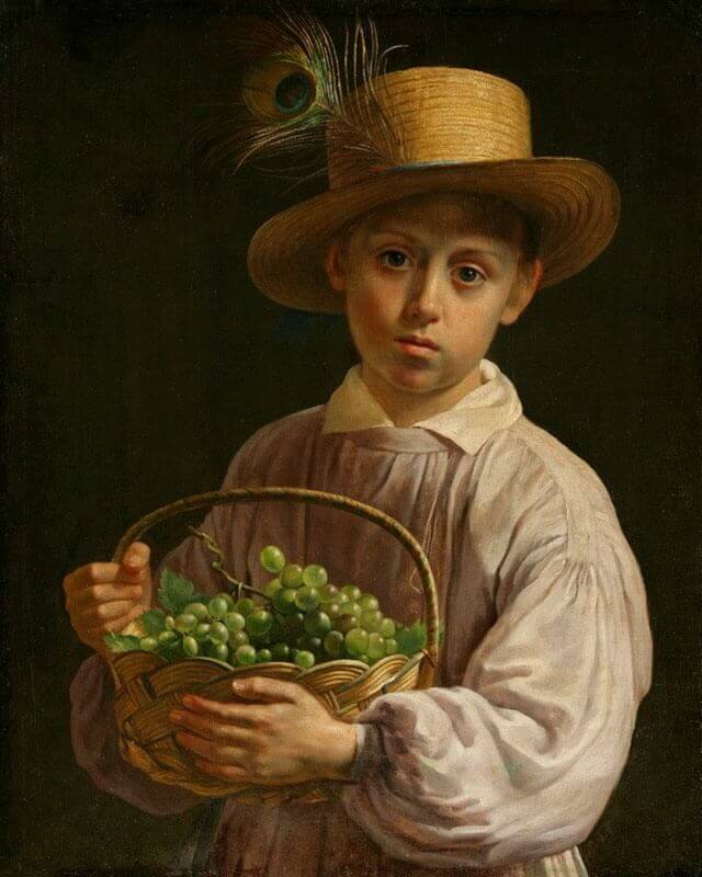 Portrait of a boy with a straw hat